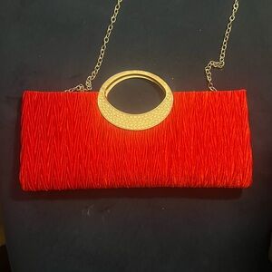 Elegant Red Clutch with Gold Chain